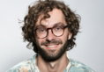 smiling man with glasses and beard portrait