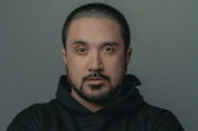 man in black hoodie standing