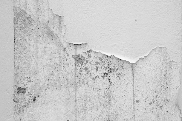 white concrete wall with hole